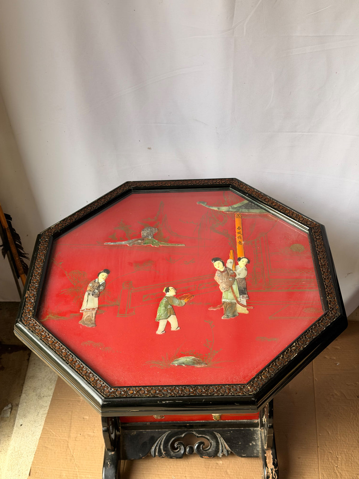 Vintage Chinoiserie Red Lacquer Octagonal Tilt Top Table Carved Stone Figures