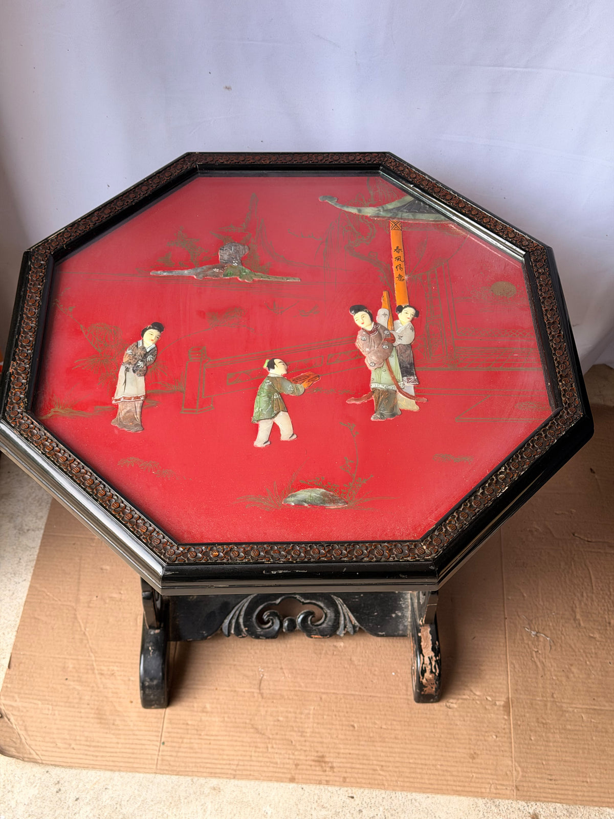 Vintage Chinoiserie Red Lacquer Octagonal Tilt Top Table Carved Stone Figures