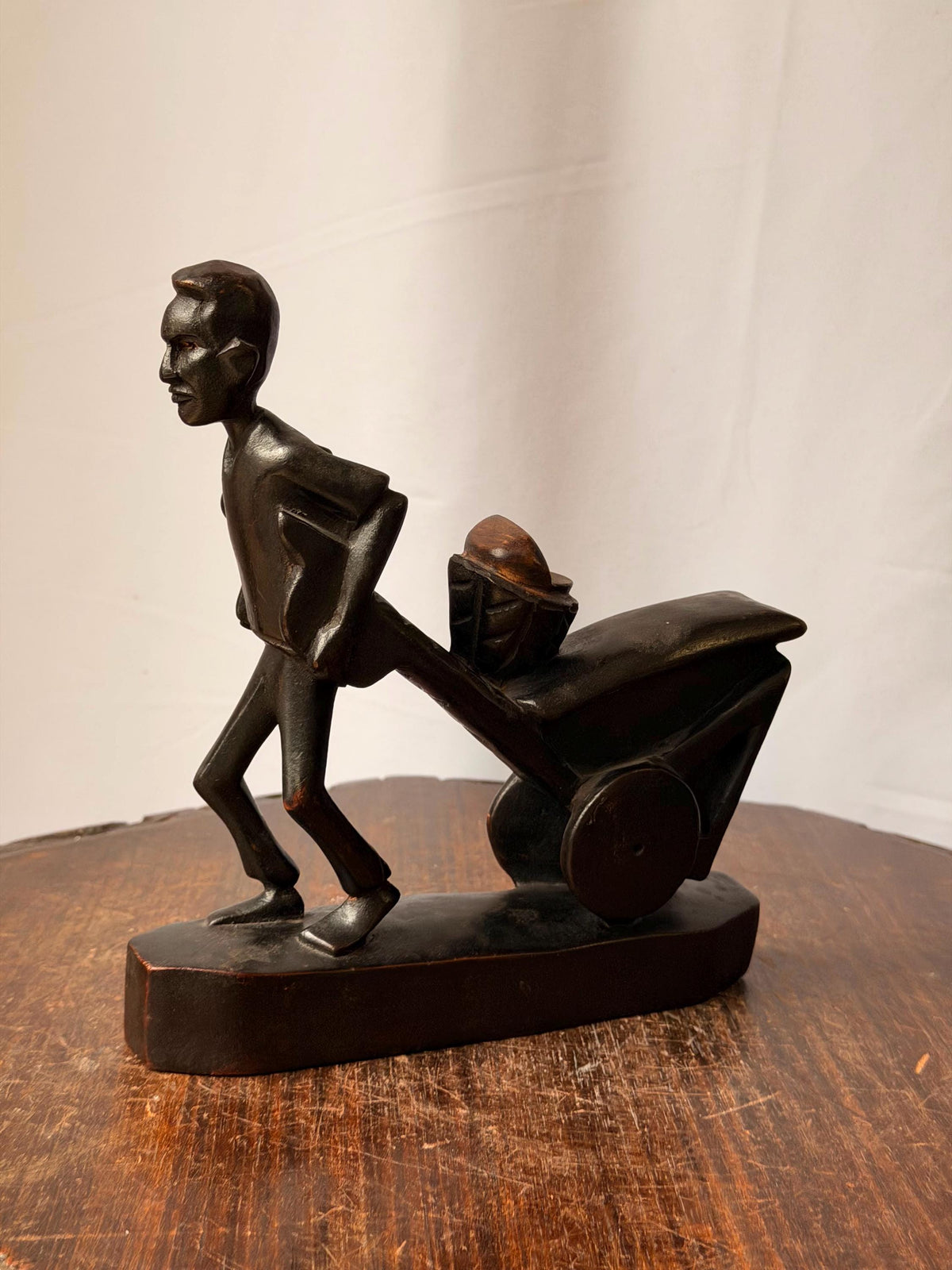 Vintage Carved Wood Man Pushing Cart Sculpture Wheelbarrow Labor Statue 8"